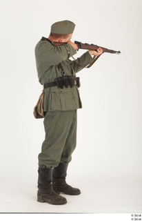 Photos German Soldier in historical uniform 4 WW II aim…